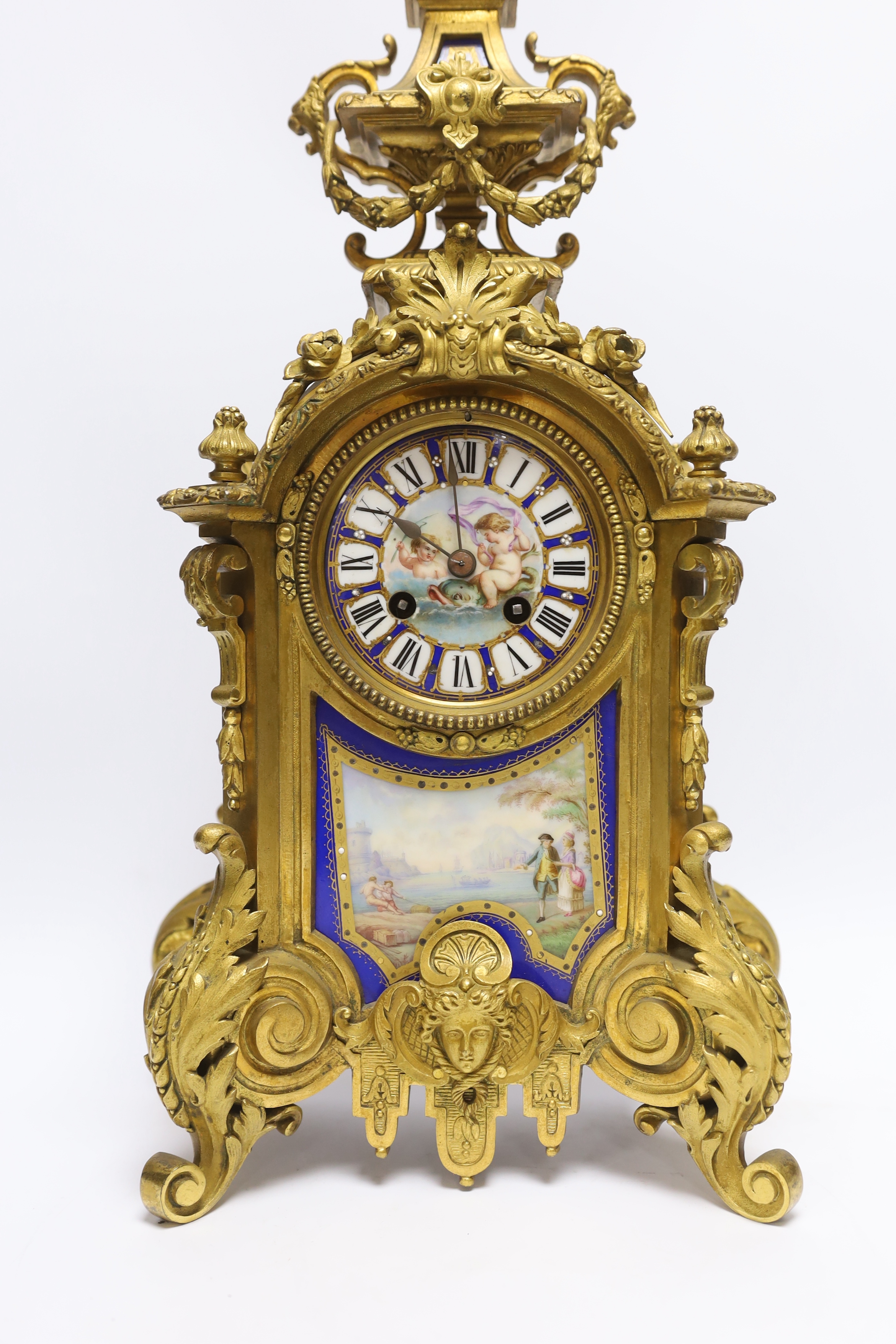 A Sevres style ormolu clock, Miller & Sons with two similar gilt spelter urns, pendulum no key, 44cm